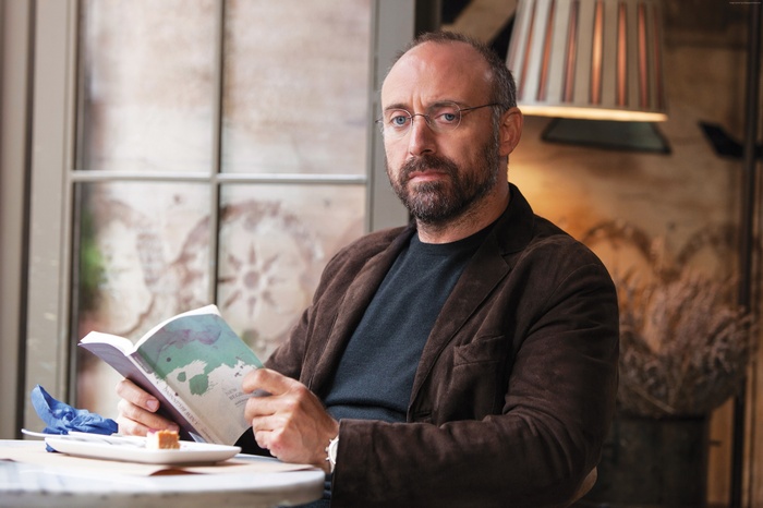 Halit Ergenc reading a book
