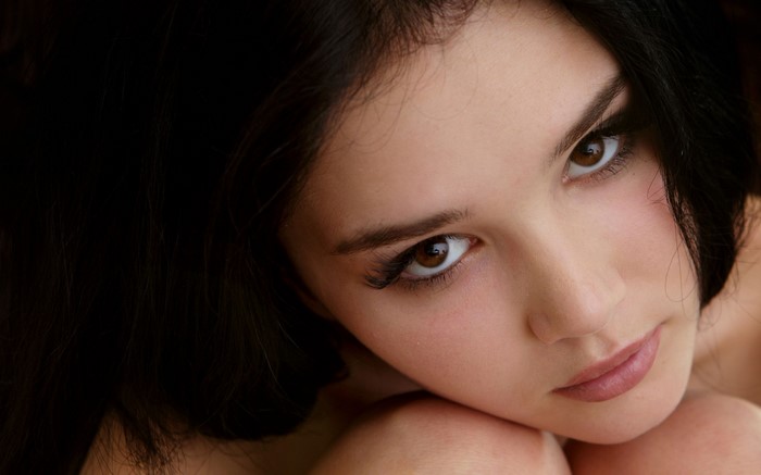 Close-up Portrait of Woman with Dark Hair and Brown Eyes