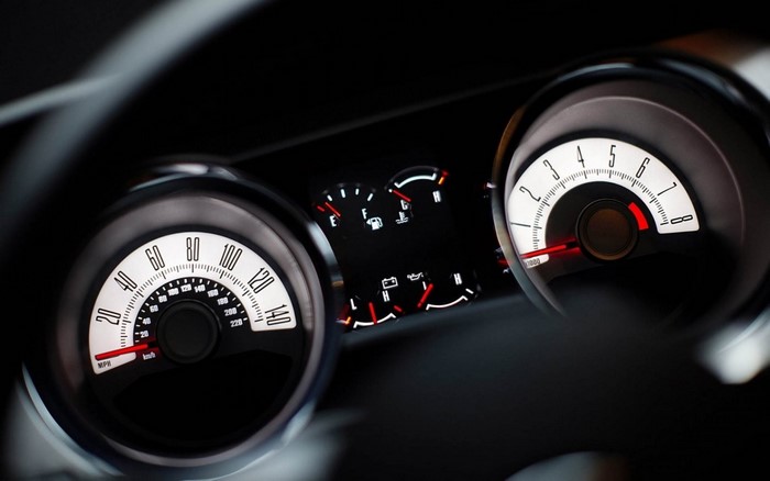Car dashboard with speedometer and tachometer