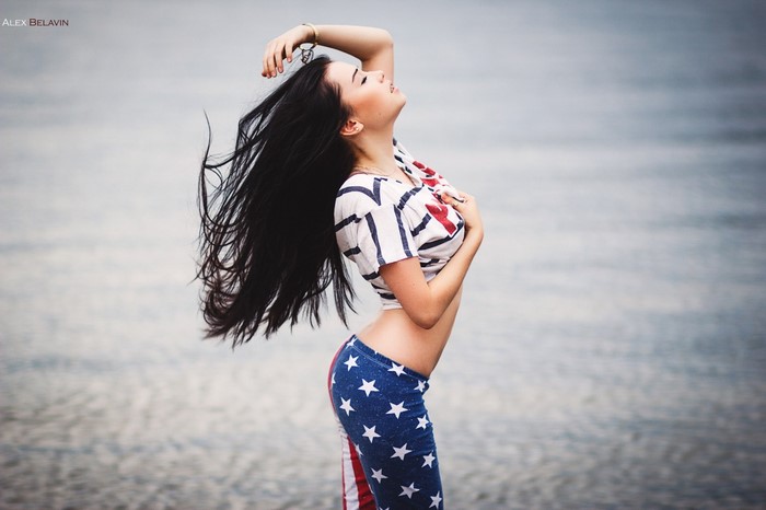 Woman in American flag pants and striped shirt