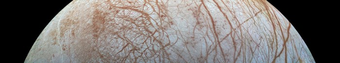 Europa's icy surface with reddish-brown streaks