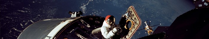 Astronaut performing spacewalk outside Apollo spacecraft
