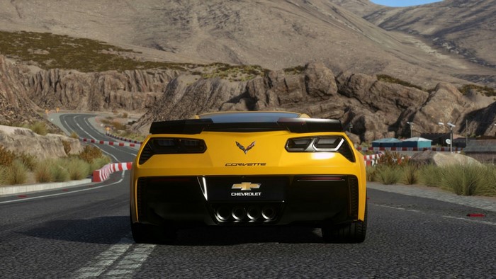 Yellow Chevrolet Corvette Z06 on a Mountain Road