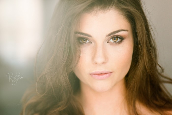 Close-up portrait of a young woman with brown hair