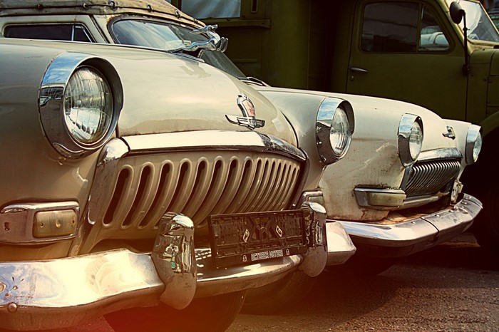 Two vintage GAZ 21 Volga cars parked side-by-side