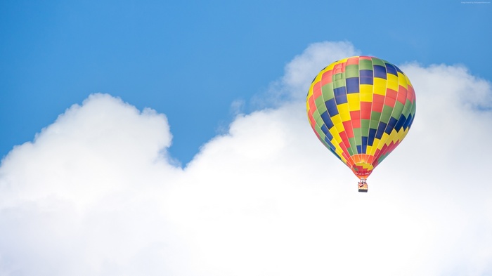 Colorful hot air balloon in the sky with clouds