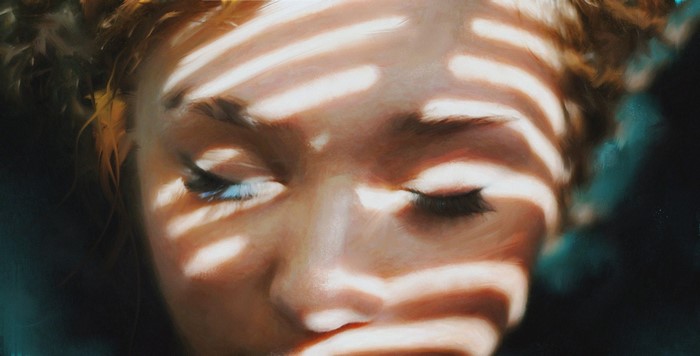 Painting of a woman's face with light and shadow