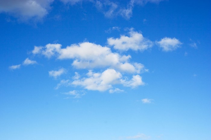 Blue sky with white cumulus clouds