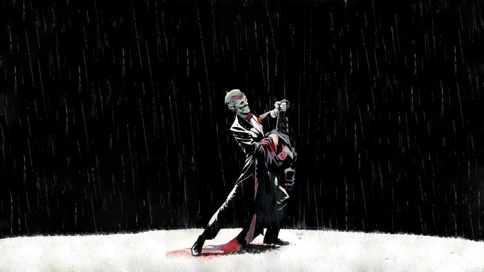 Joker holding Batman in the rain
