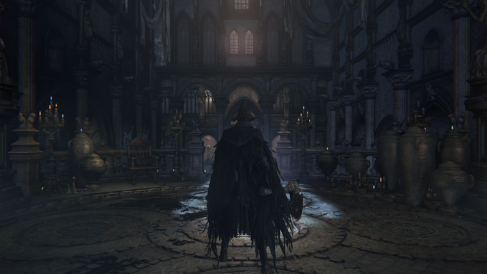 Character in dark cloak in Bloodborne cathedral