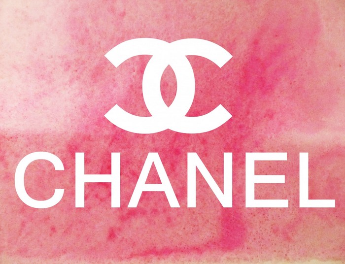 Chanel logo on pink watercolor background