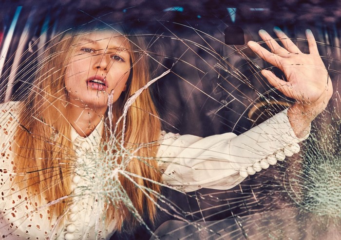 Woman behind broken glass