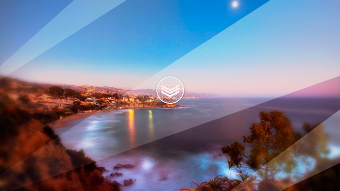 Coastal town at sunset with geometric overlay