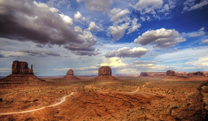 Monument Valley desert landscape with buttes and clouds