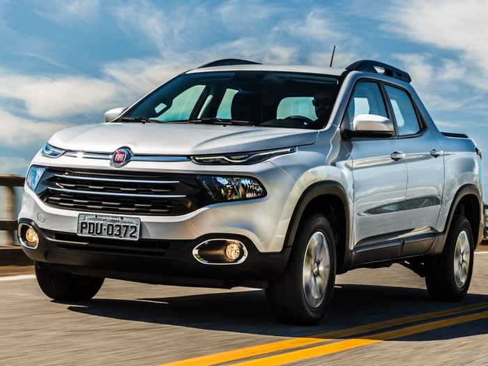 Fiat Toro pickup truck driving on a road