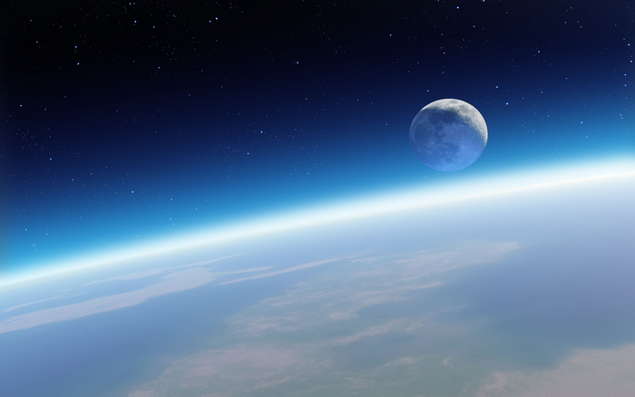 Earth and Moon from space with stars