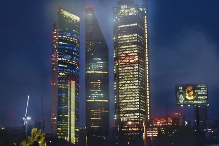 Mexico City skyscrapers at night with billboard