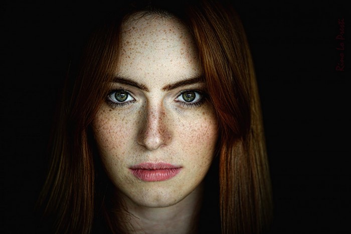 Close-Up Portrait of Freckled Redhead Woman