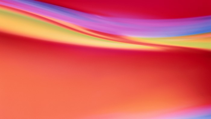 Abstract colorful wavy lines on red background