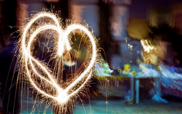 Heart shape sparkler at night