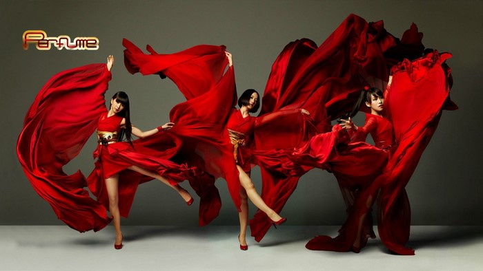 Perfume J-pop group in red kimonos dancing