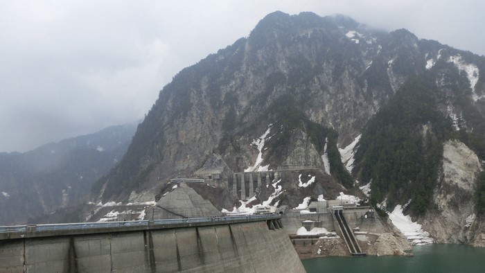 Kurobe Dam, Japan, with snow-capped mountains and reservoir