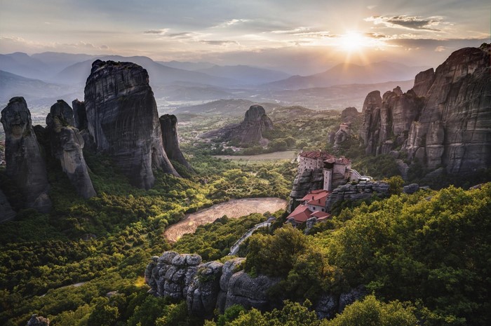 Sunset Over Rocky Valleys and Monastery in Greece
