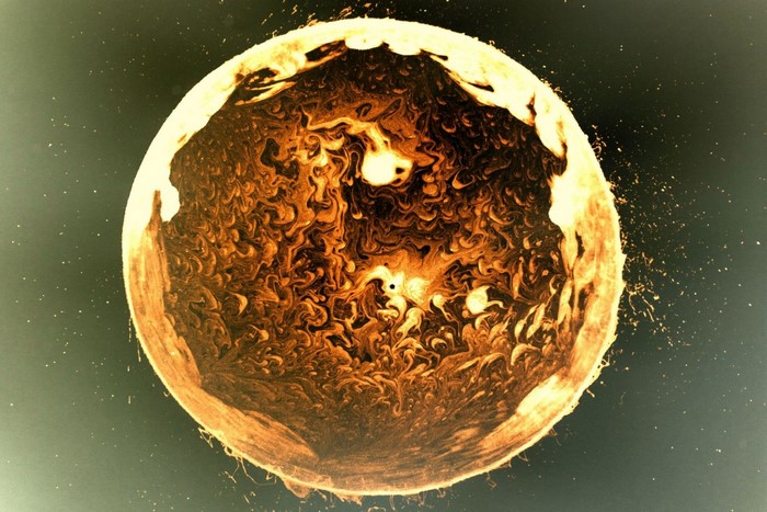 Abstract sphere with swirling patterns and bright edges