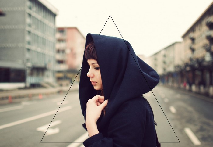 Woman in black hood on a street