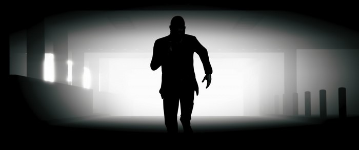 Silhouette of a man running in a foggy environment