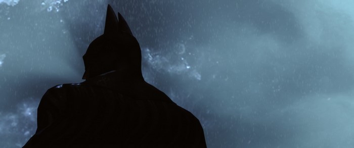 Batman from Batman: Arkham Knight in a dark, rainy environment