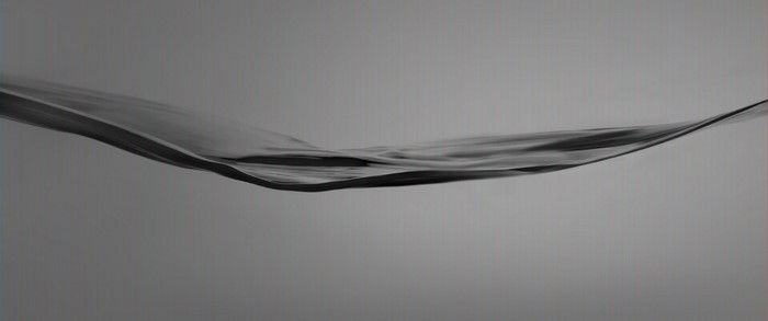 Abstract monochrome wave of dark liquid