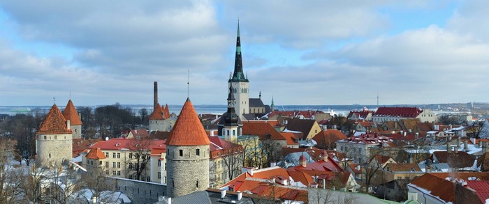 Panoramic winter cityscape of Tallinn with towers and churches