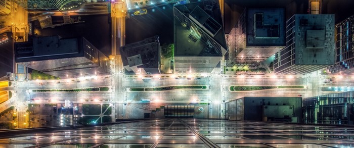 Aerial view of a city at night with skyscrapers and lights