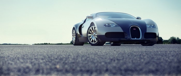 Bugatti Veyron sports car on asphalt road