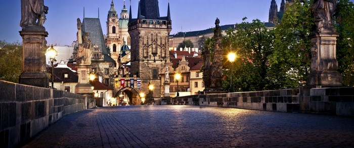 Charles Bridge at night with Prague Castle in the background