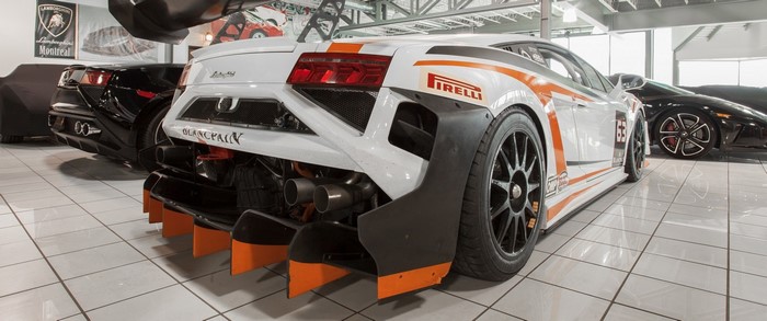 White Lamborghini race car with orange accents