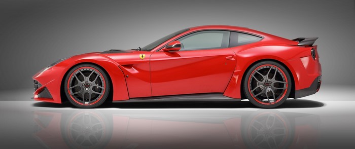 Red Ferrari sports car with custom wheels