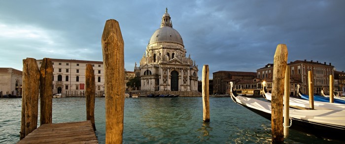 Venice cityscape with Basilica di Santa Maria della Salute and gondolas