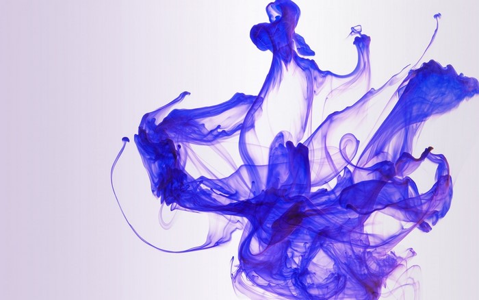 Purple and blue ink swirling in water