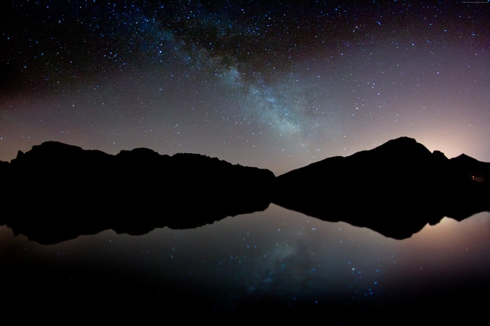 Milky Way over Mountains and Lake Reflection