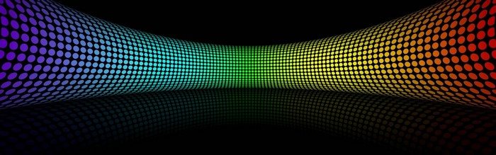 Abstract rainbow-colored dots forming a wave pattern