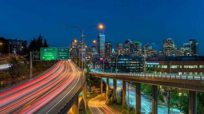 Seattle Skyline at Night with Light Trails on Highway