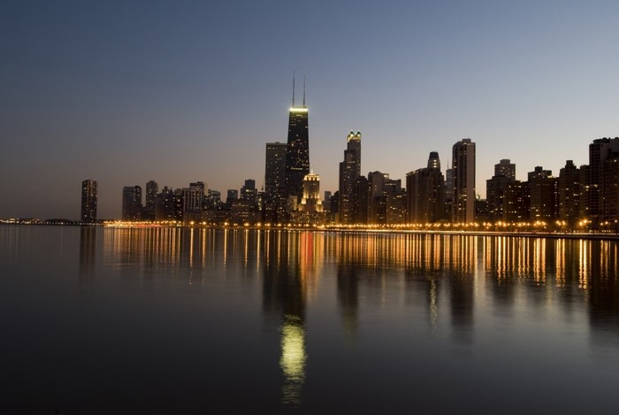 Chicago skyline at dusk with reflections on the water