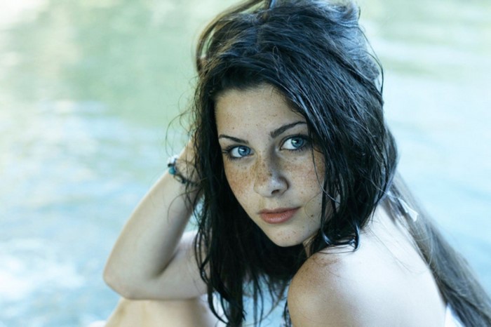 Portrait of Woman with Blue Eyes and Freckles