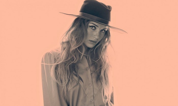 Zella Day wearing a hat