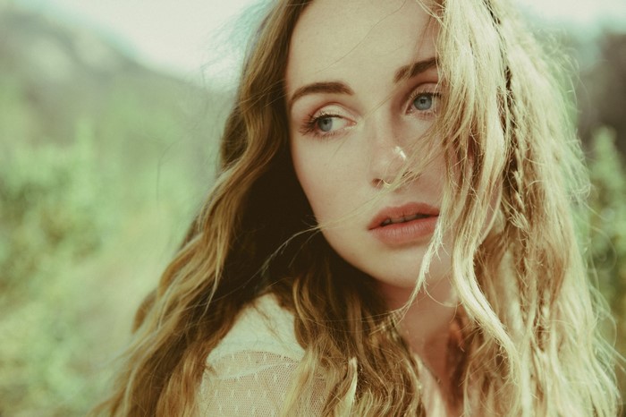 Woman with long blonde hair and blue eyes