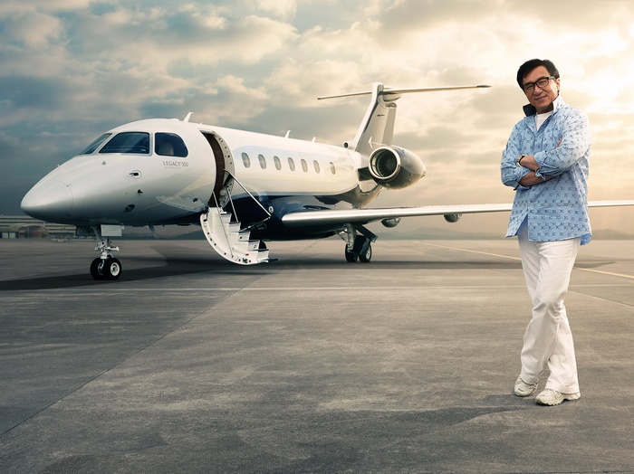 Jackie Chan with a Legacy 500 private jet