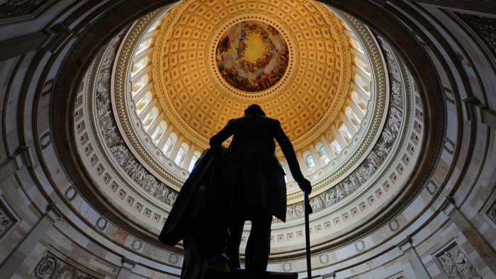 Statue of George Washington under the dome of the US Capitol