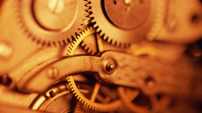Close-up of clockwork gears and screws